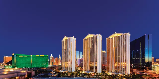 Exterior of The Signature at MGM Grand shows 3 identical tall stone buildings with 40 floors each.