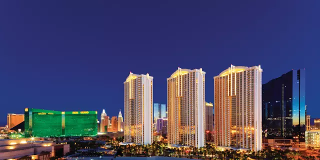 Exterior of The Signature at MGM Grand shows 3 identical tall stone buildings with 40 floors each.
