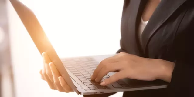 Business woman working about network by notebook  in the office.