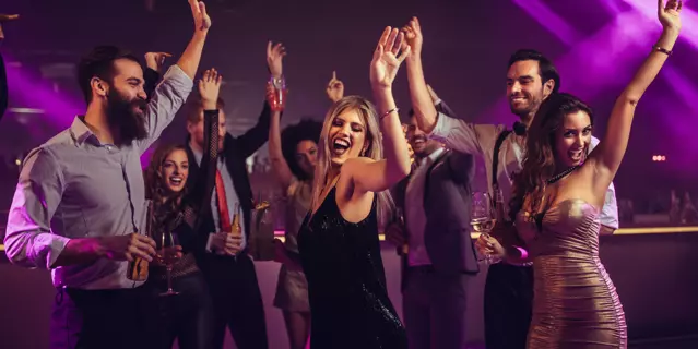 Shot of a young woman partying in a nightclub