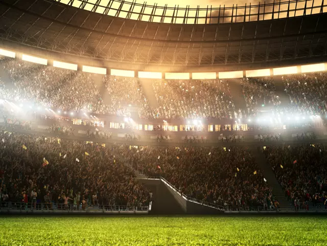 Photo of a professional soccer stadium while the sun shines. Stadium and crowd are made in 3D