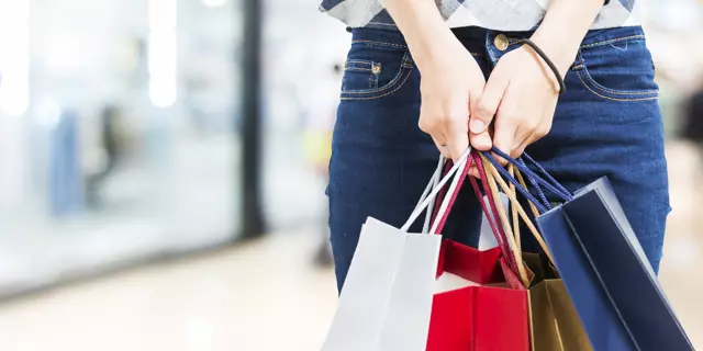 Concept of woman shopping and holding bags, closeup images.