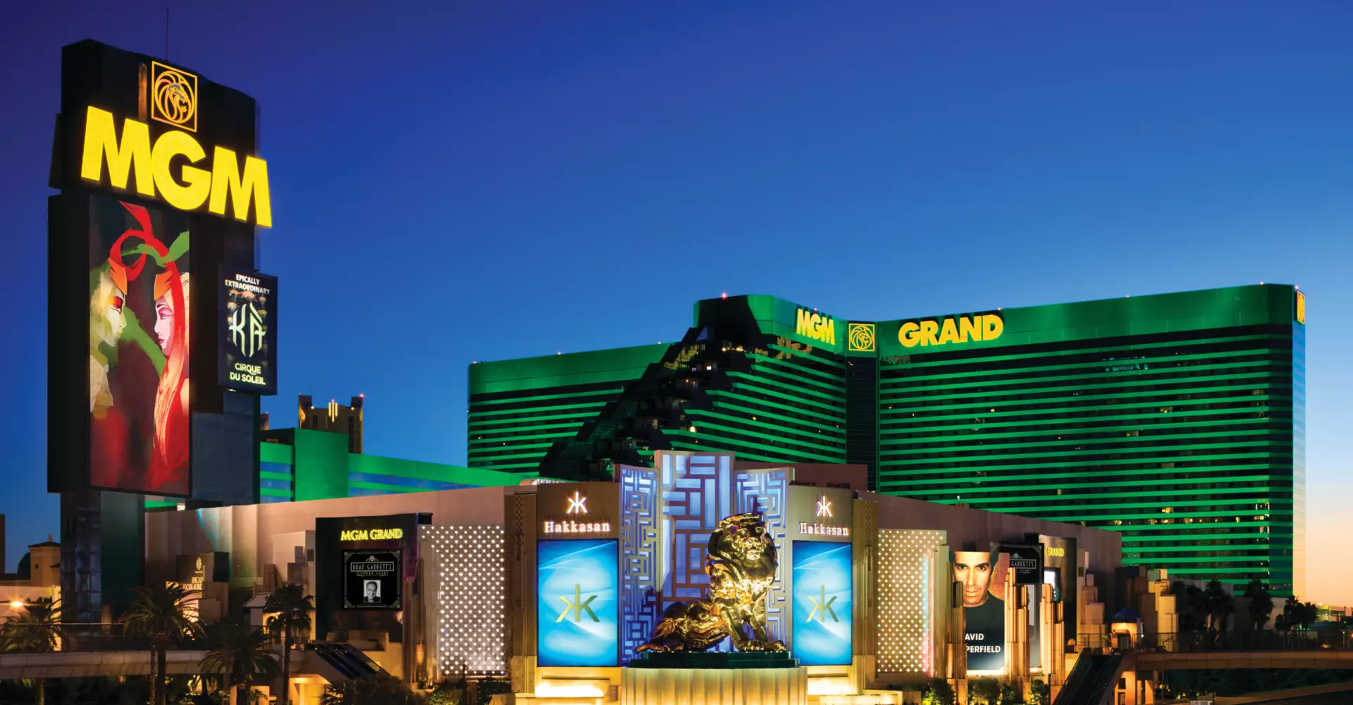 The MGM Grand lit up in emerald green on the Las Vegas Strip at night
