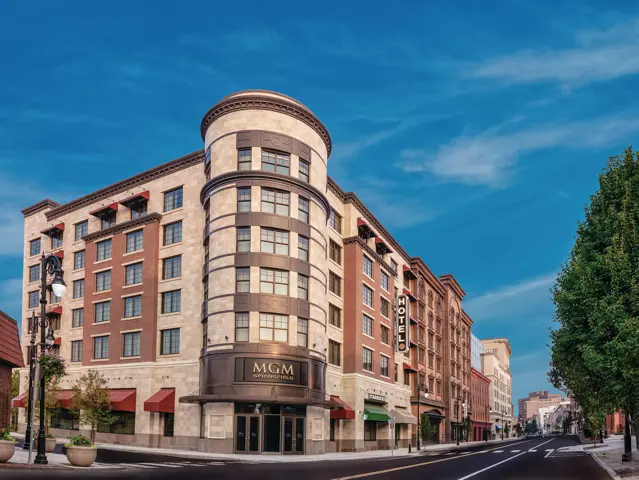 Exterior of MGM Springfield shows a hotel located on the corner of a city block.