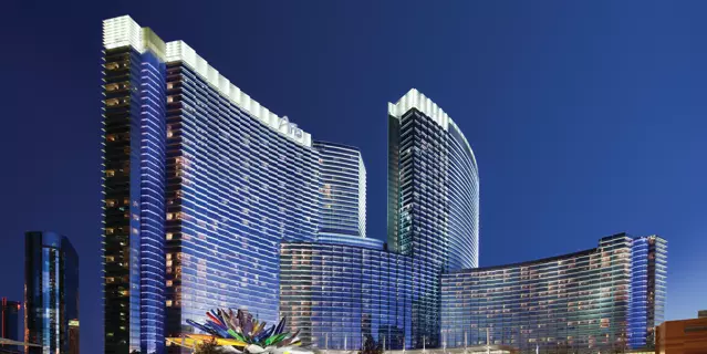 Exterior of ARIA with two thin mirrored-glass, curved buildings with 28 floors each.